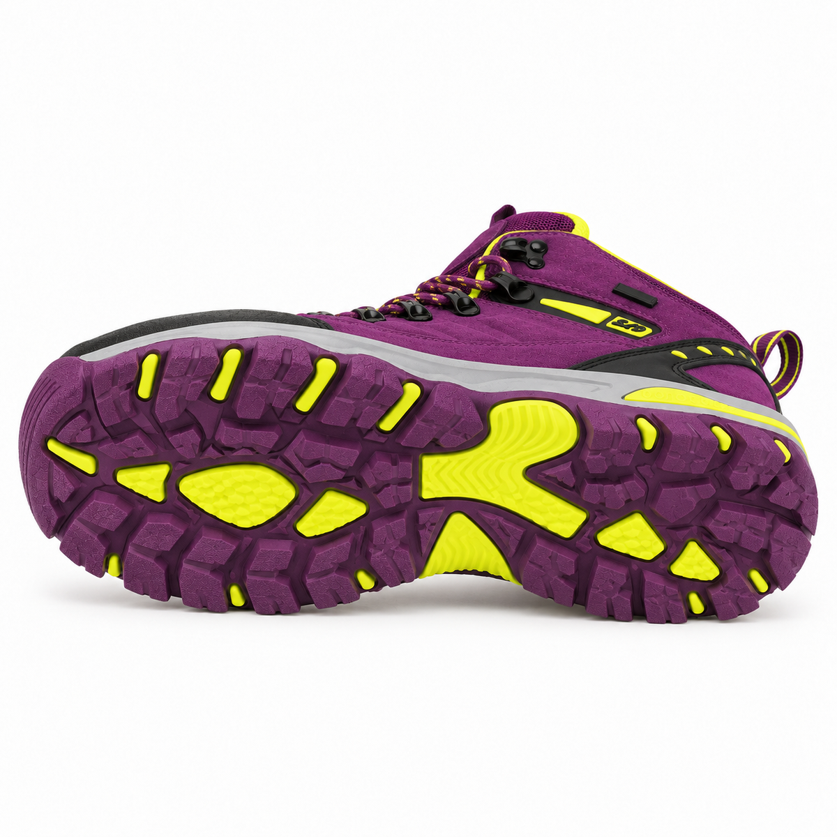 Chaussure randonnée violette couchée sur le côté montrant toute la semelle attachée