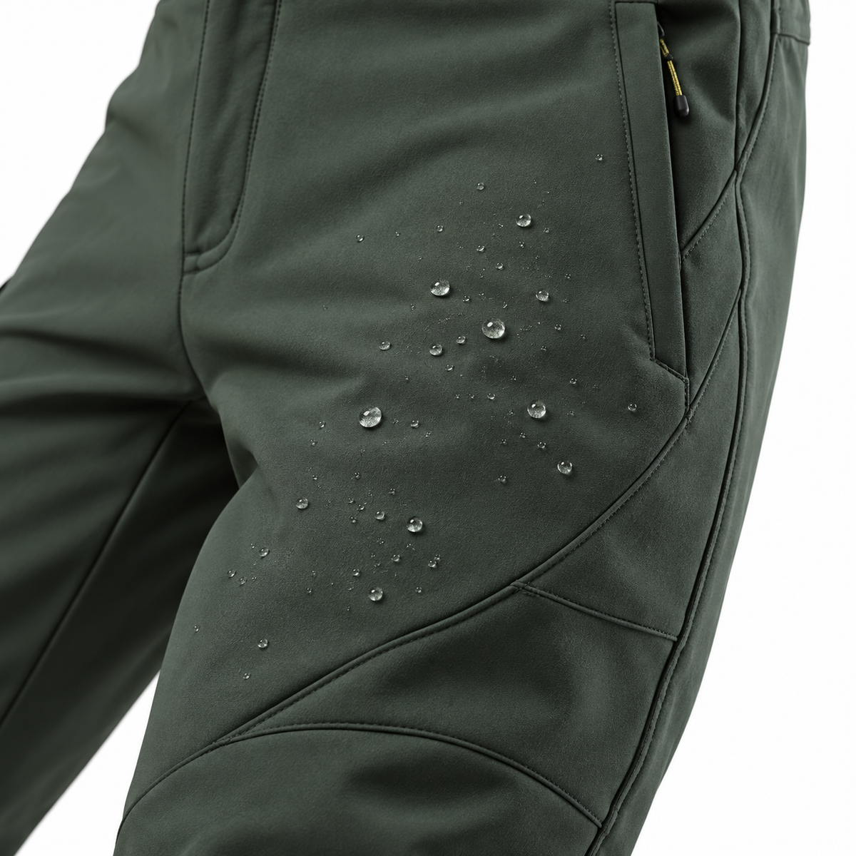 Pantalon randonnée neige homme — gouttes perlantes sur le tissu vert foncé