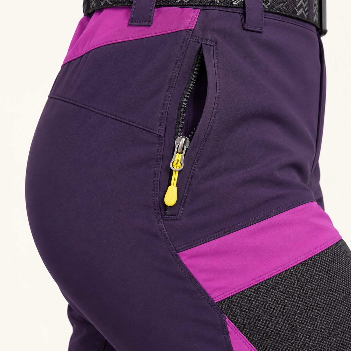 Poche zippée jaune du pantalon randonnée femme violet