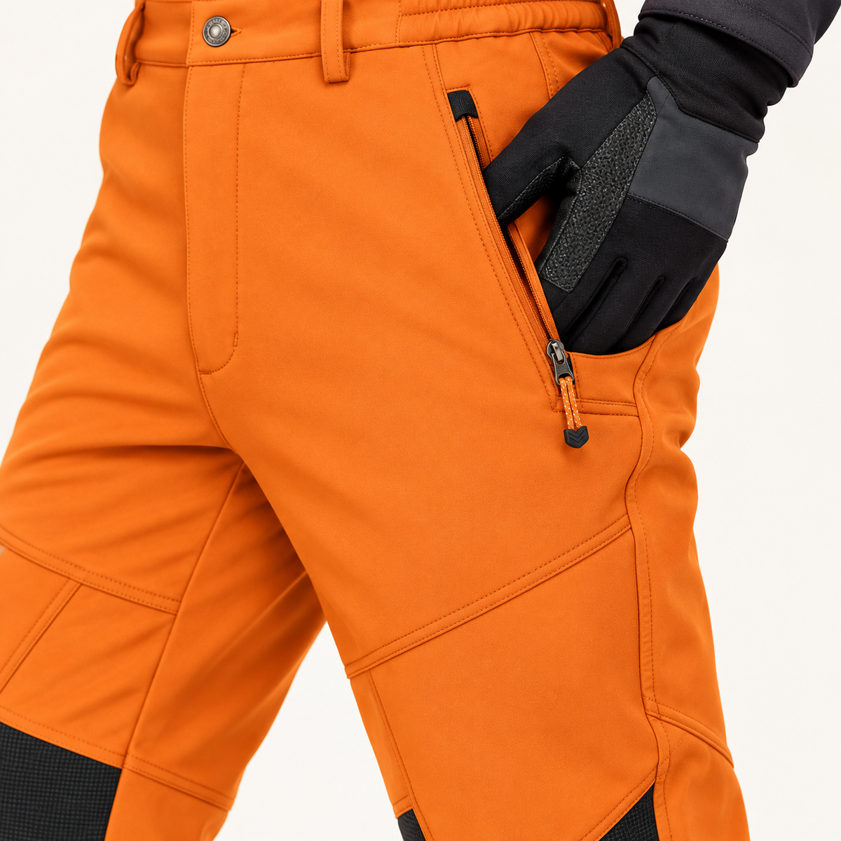 Poche zippée du pantalon randonnée raquette homme orange