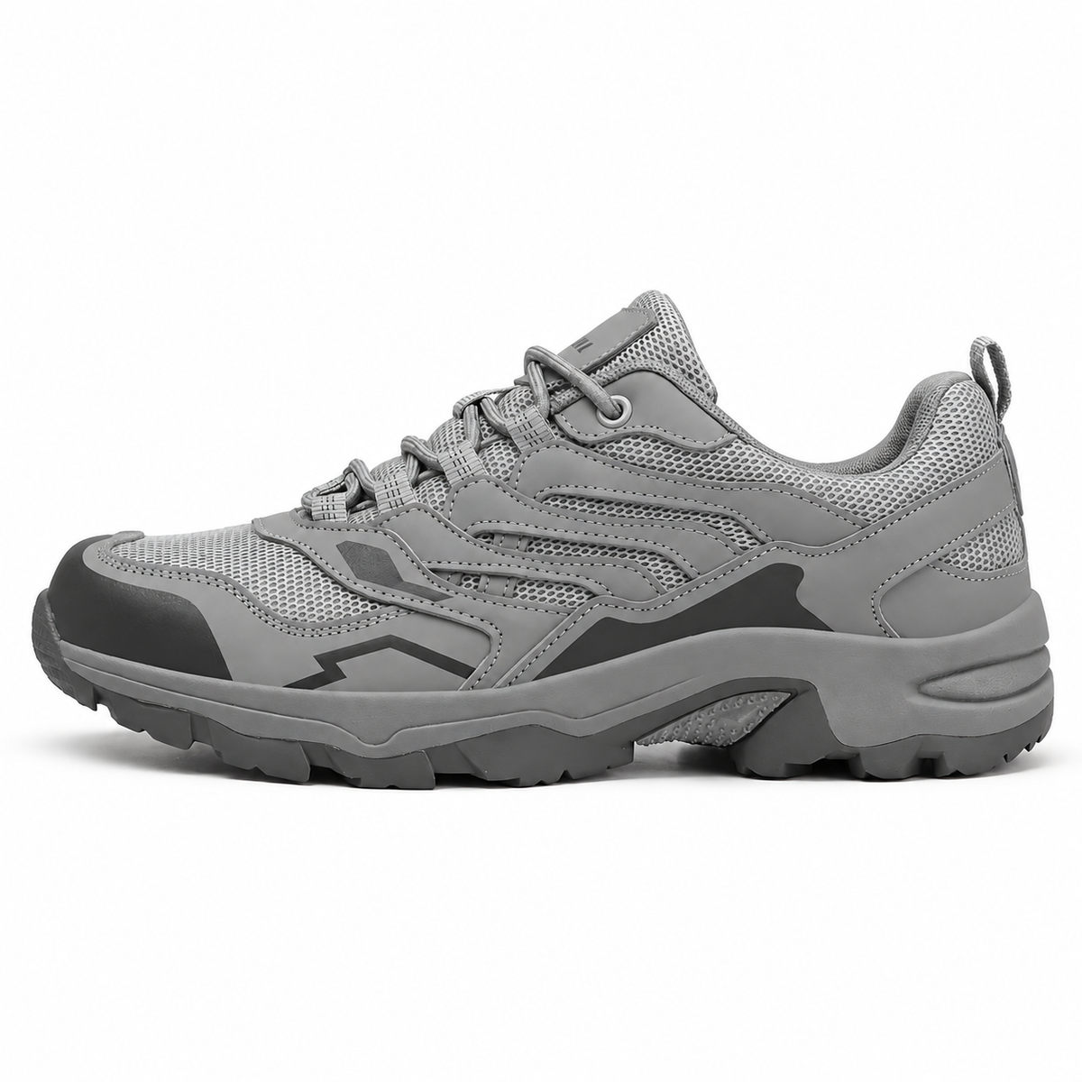 Chaussure d’approche randonnée grise vue de profil avec silhouette basse et semelle attachée