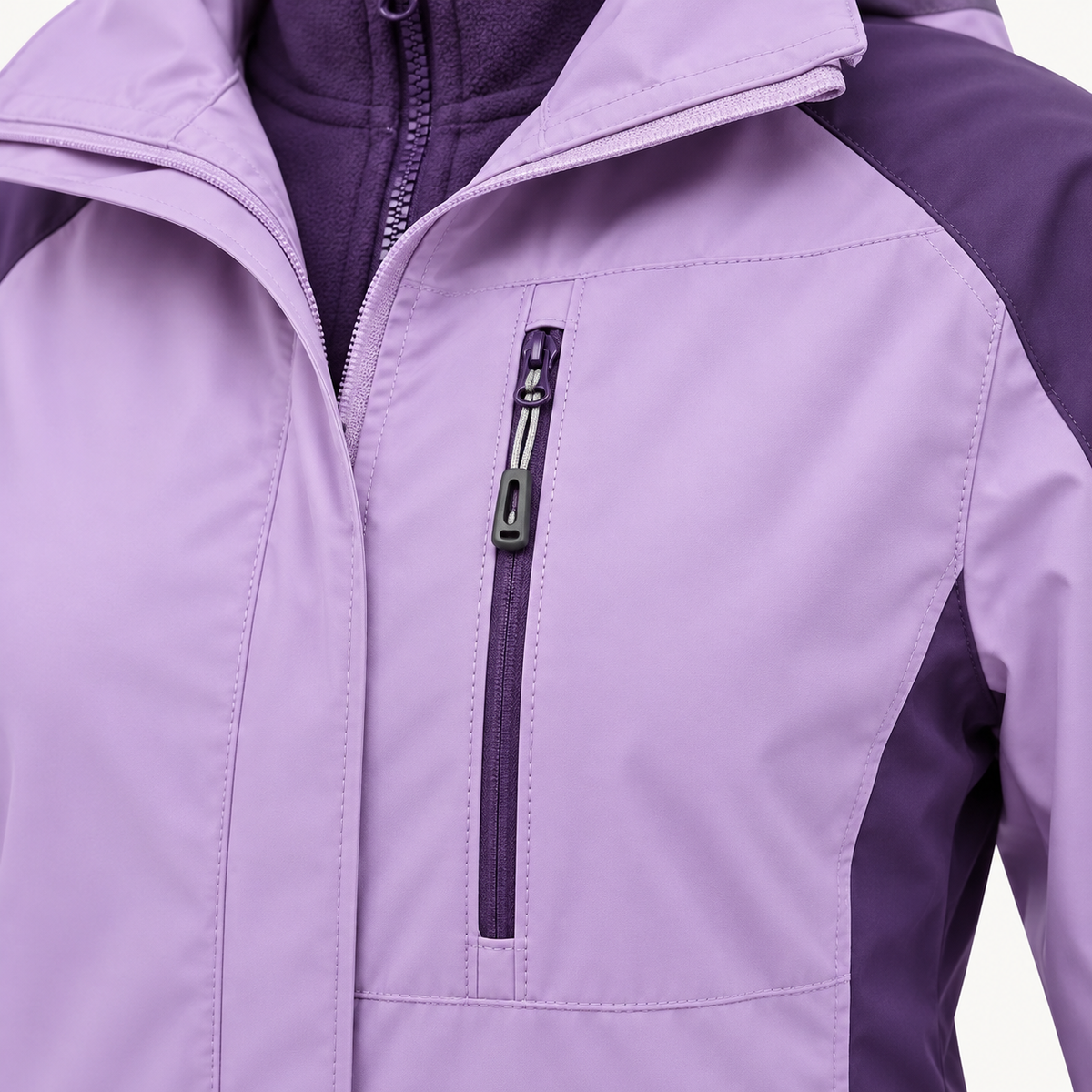 Veste coupe vent femme randonnée – détail poche poitrine zippée