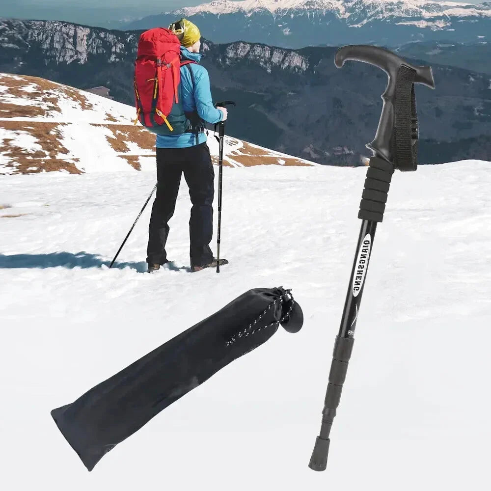 Black telescopic hiking pole with textured grip and branded label, accompanied by a black carrying sleeve