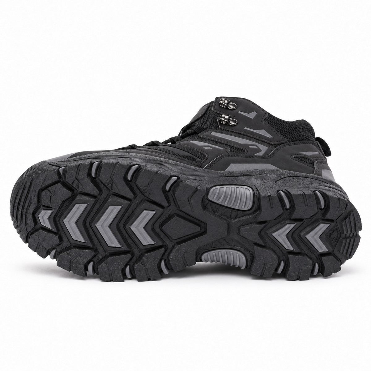 Chaussure randonnée femme noire posée sur le côté, semelle extérieure entière visible