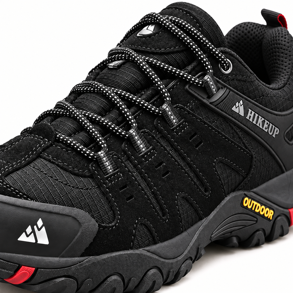 Chaussure randonnée femme noire avec accents rouges – détail des matières, coutures et du laçage