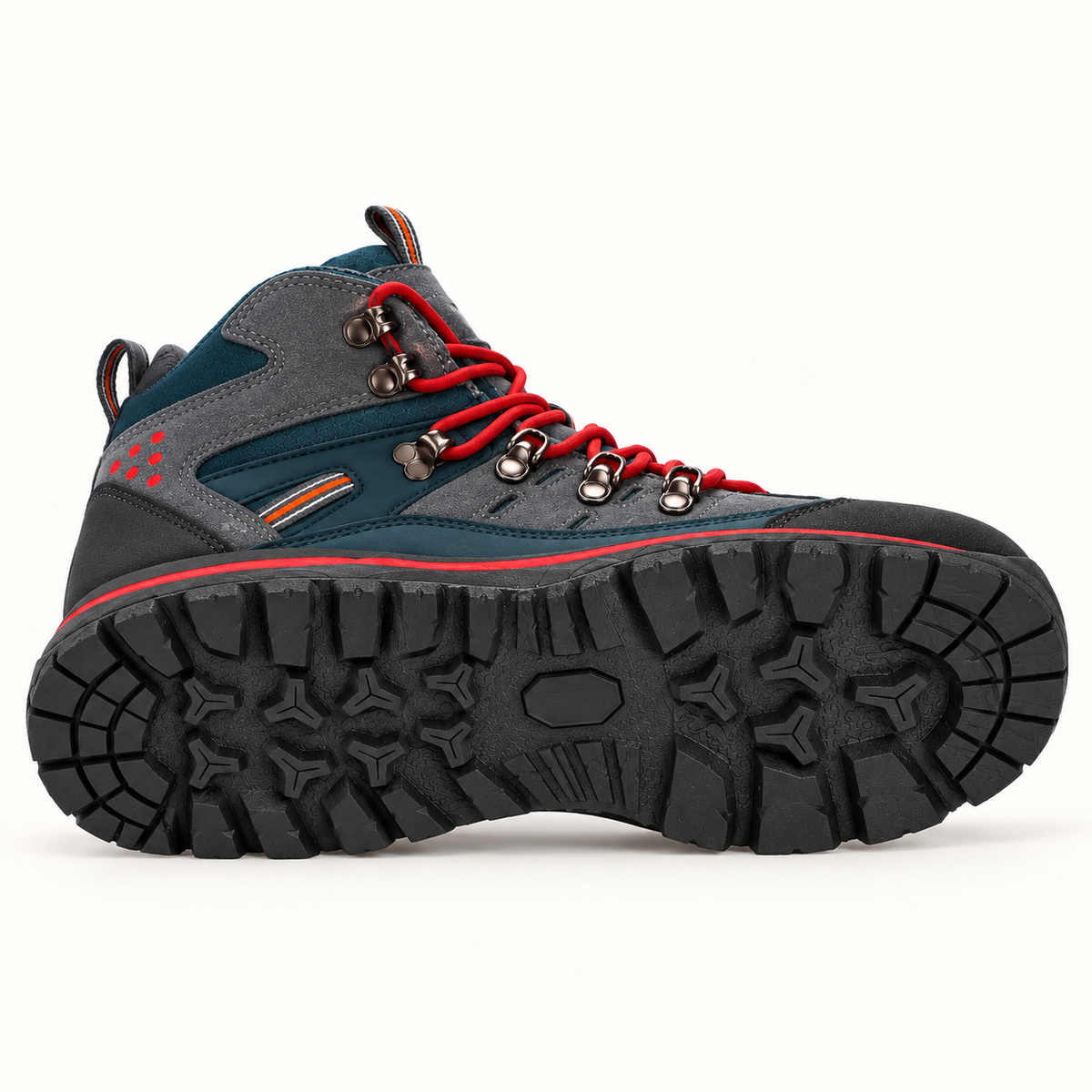 Semelle extérieure entière de la chaussure randonnée mid homme rouge posée sur le côté