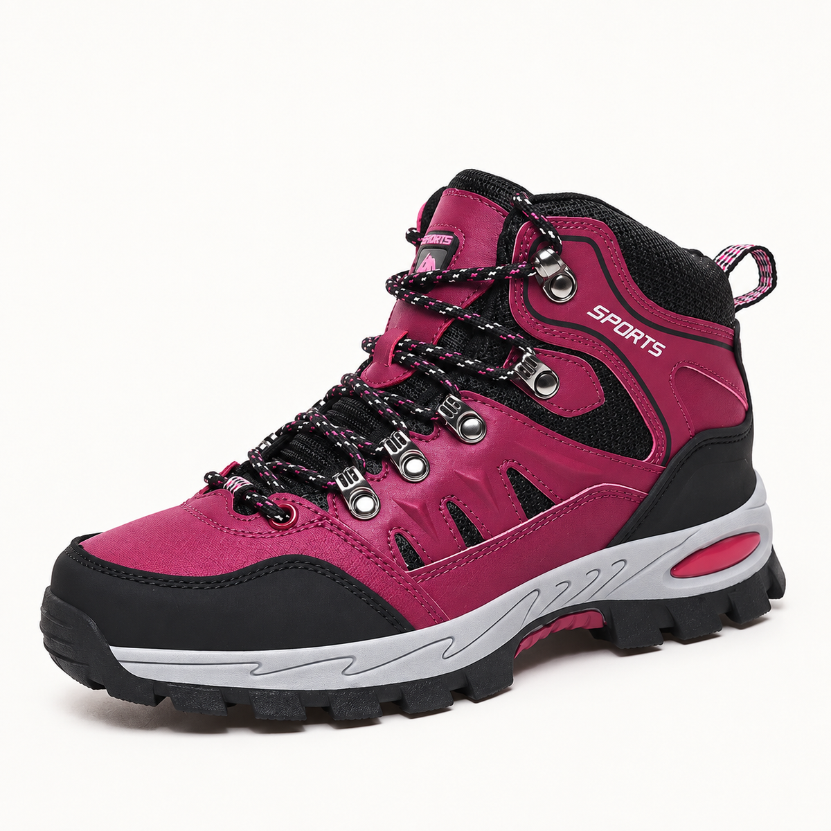 Chaussure mid randonnée légère rose en vue trois-quarts sur fond blanc chaud