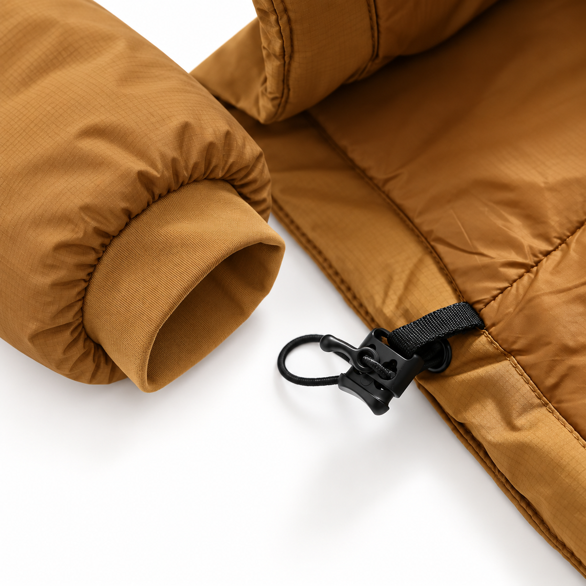 Veste imperméable randonnée homme marron – détail poignet et ourlet